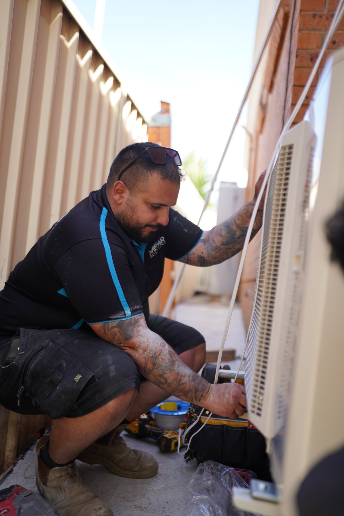 Technician servicing a split system